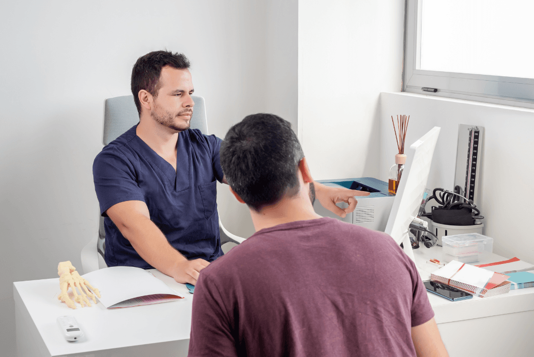 Physiotherapist explaining home exercise program to patient