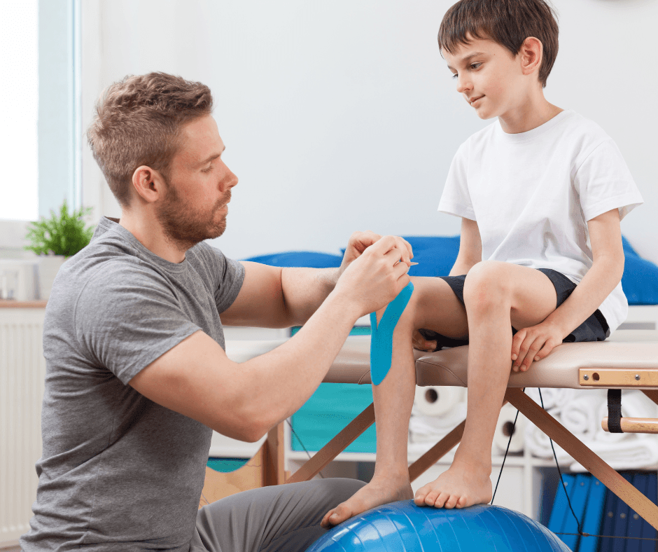 Kinesiologist applying kinesio tape